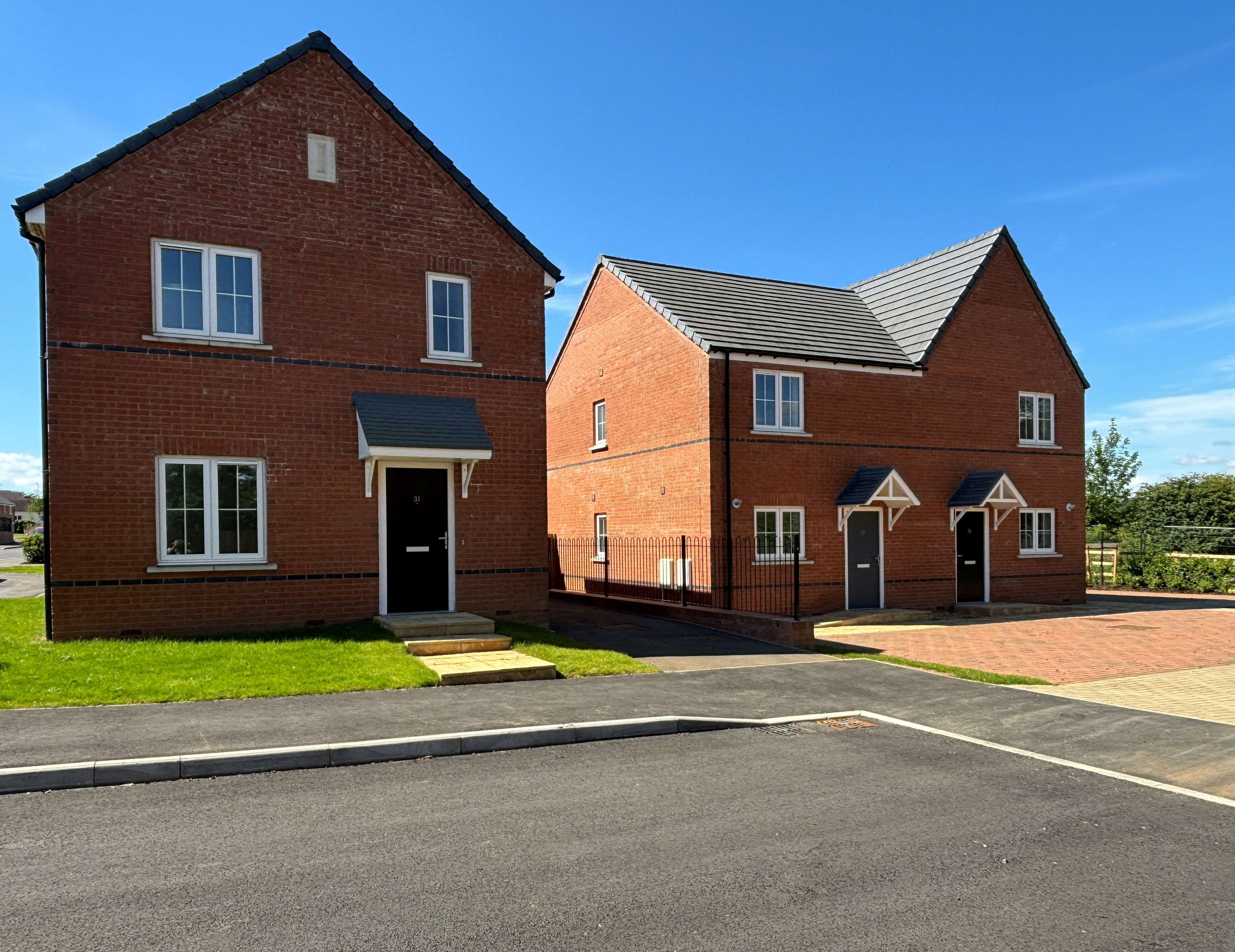 Photo of three new build houses