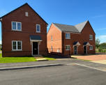 Photo of three new build houses