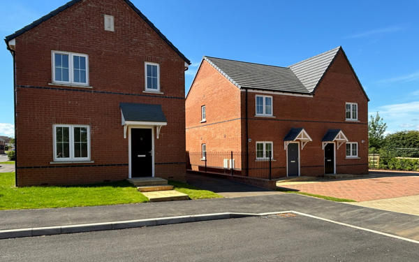 Photo of three new build houses