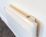 Close up photo of an electrical heating unit installed in a flat