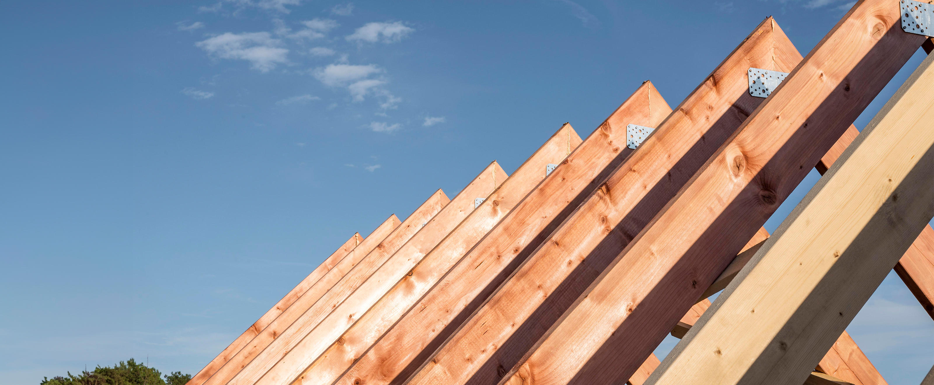 Close up photo of roof beams for a new home under construction