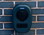 close up view of an electric car charging point on an exterior brick wall